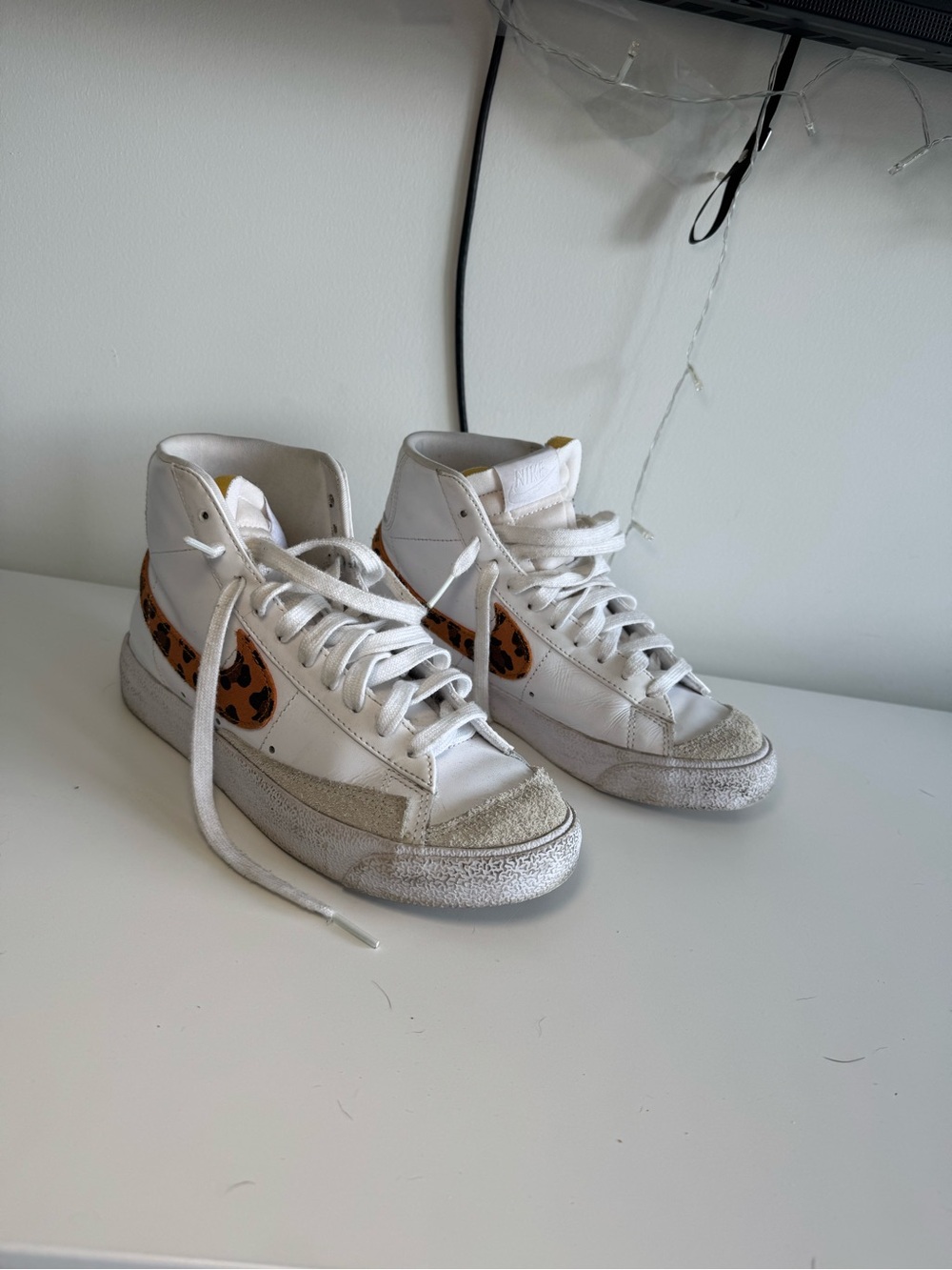Nike White High-Top Sneakers with Leopard Swoosh